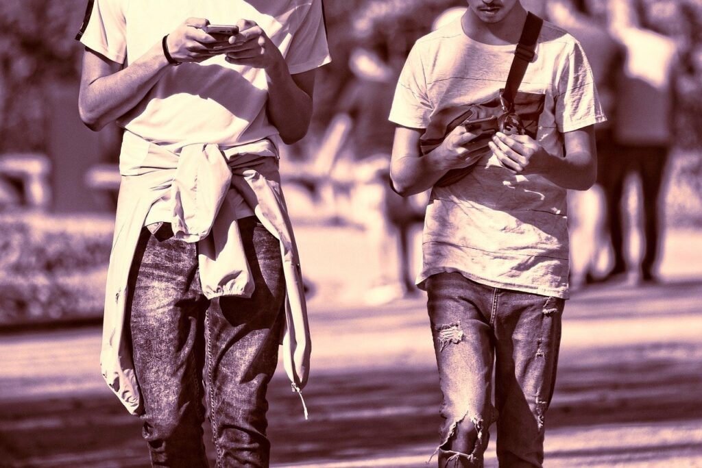 young boys using phone